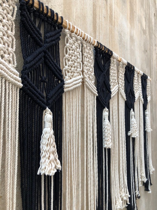 Macrame wall hanging headboard