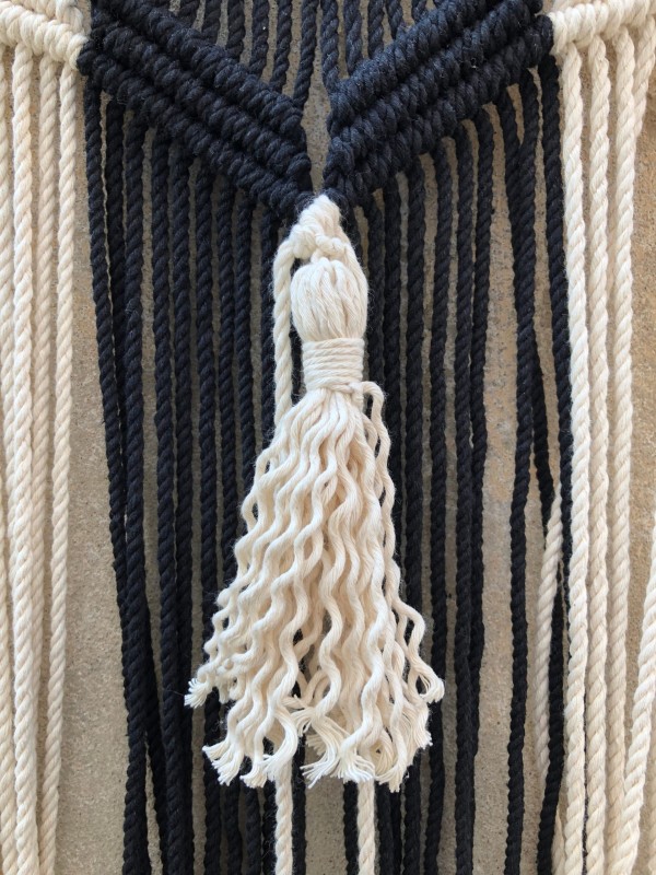 Macrame wall hanging headboard
