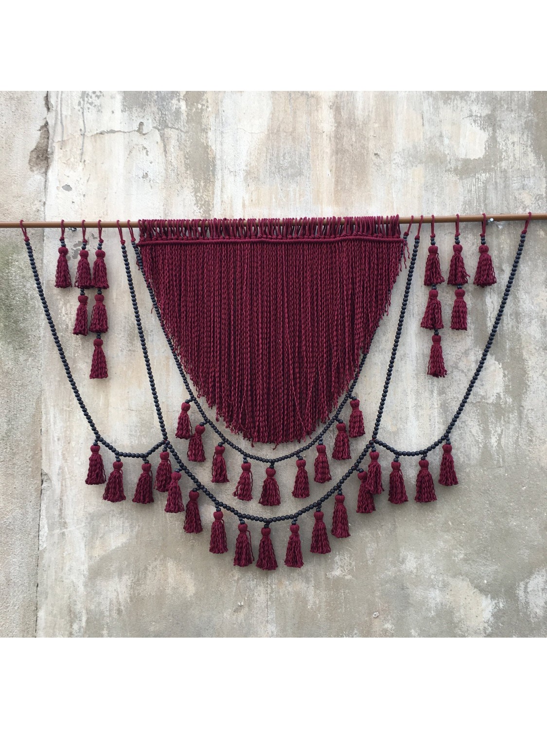 Red macrame headboard with beads