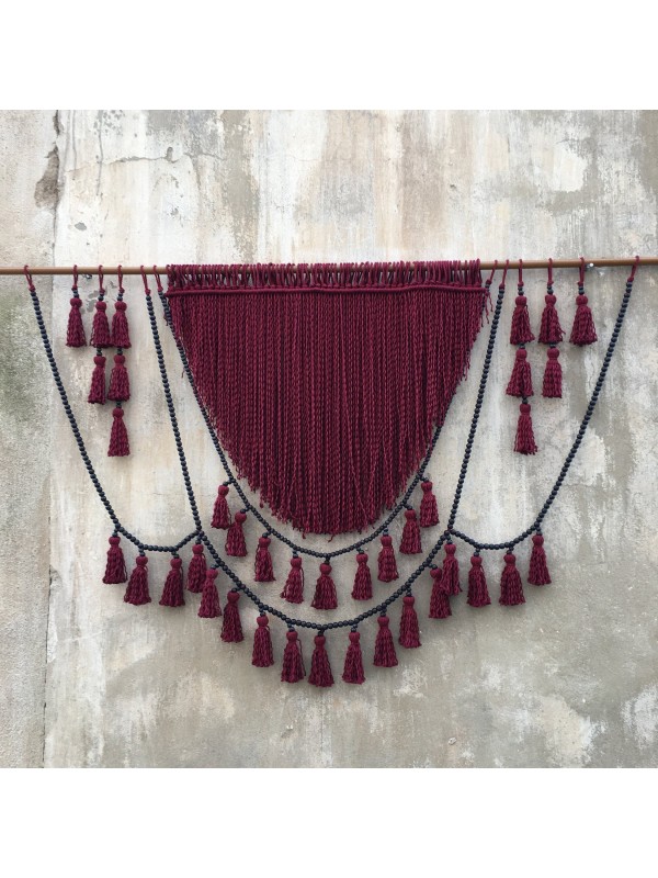 Red macrame headboard with beads