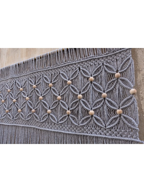 Gray macrame wall hanging headboard